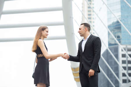 Business people shaking hand together.