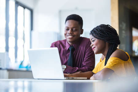 business man and women African American black skin addressing working with laptop corporate business...