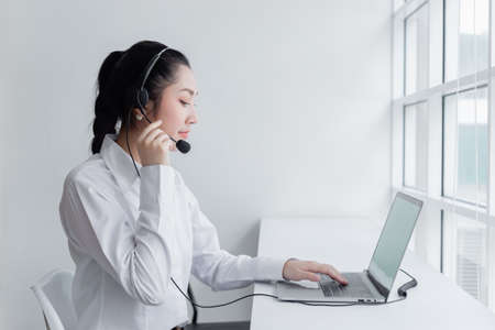 Woman operators with microphone and computer laptop at work, Call center, support telemarketing....