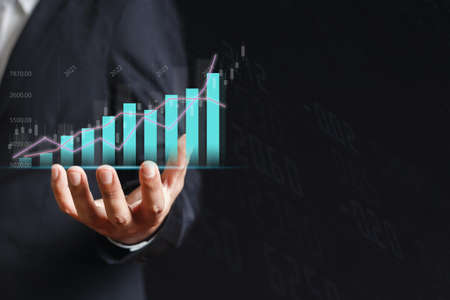 Trading graph appear from the hand of businessman, Stock exchange marketing analyzing chart....