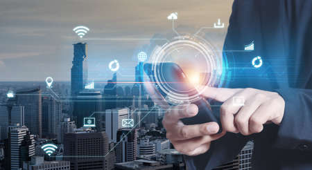 Businessman using smartphone with network connection technology and digital exposure city...