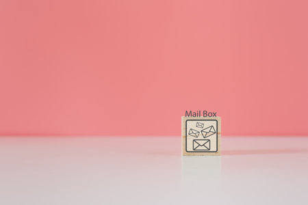 Wooden cube blocks with letter icon and mailbox word. contact mail message. online logistic concept.の写真素材