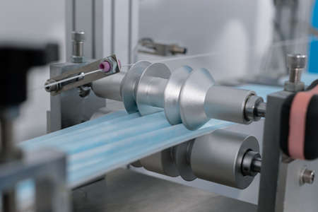 mask factory industry manufacturing line produces. equipment protection