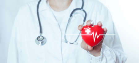 woman doctor in white uniform holding red medical heart, pulse check cardiology, diagnosis healthy...