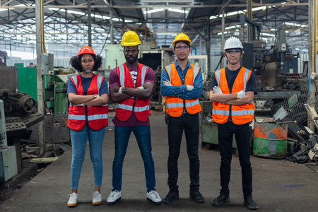 Group of various engineer professional successful team corporate workers standing in factory. teamwork technician inspector manufacturing industry workplace. Full team industrial factory concept.の写真素材