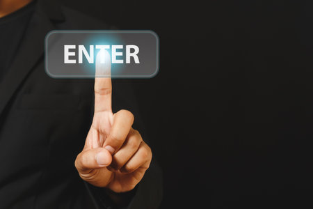 Businessman finger touch press enter button. hand click online digital.の写真素材