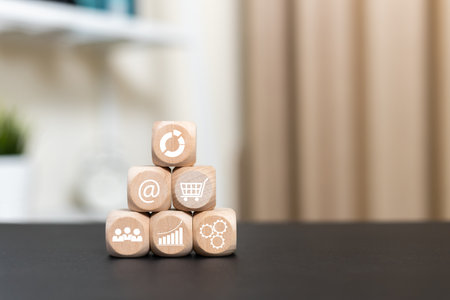 Business management concept. wooden cubes block with Business icons. target value success investment development objective customer, market abbreviation.の写真素材