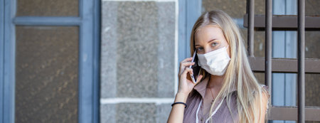 woman talking phone mobile wear mask during disease pandemic and to prevent dust that may enter the body through the nose and mouth.の写真素材