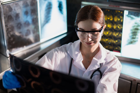 Doctor woman looking check up x-ray film in medical laboratory at hospital. Anatomy diagnostic...