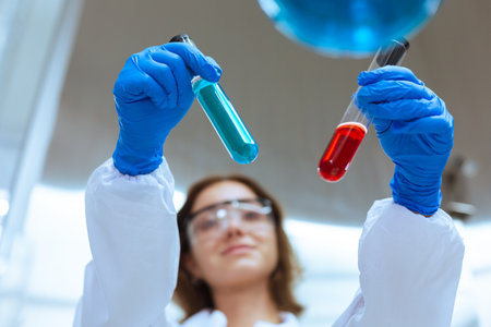 Close up chemical test tube,  women scientist working research and test chemical with test tubes in laboratory. student medical science experimenting analysis biotechnology.の写真素材