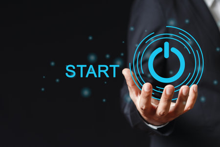 Hand holding press start button. beginning goal new target. click control success business digital.