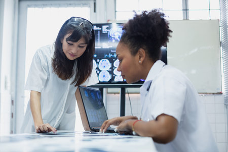 Female medical student study in class room. medical students studying human brain disease diagnosis...