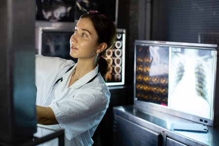 Doctor woman looking check up x-ray film in medical laboratory at hospital. Anatomy diagnostic...