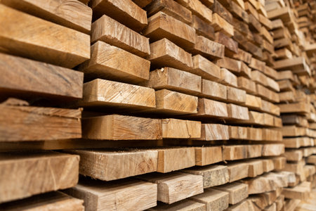 Stack of raw wood, Lumber warehouse storage wooden. Timber goods storehouse. wood import-export...