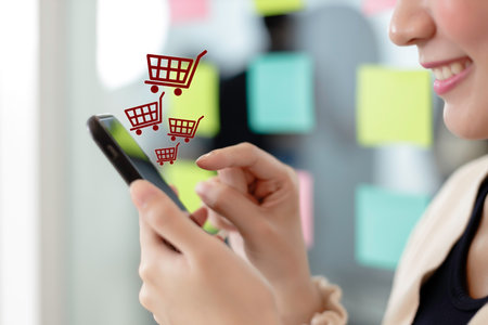 woman using smartphone shopping online, shopping cart icon on screen mobile phone. purchase payment on internet. online supermarket gadget.の写真素材