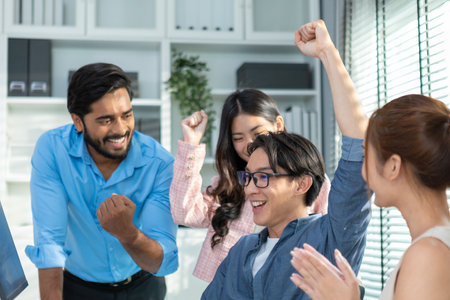 Successful of asian business person team. Success meeting Cooperation of young entrepreneurs, new generations. employees workers show hand happy brainstorming planning contract from partnership.の写真素材