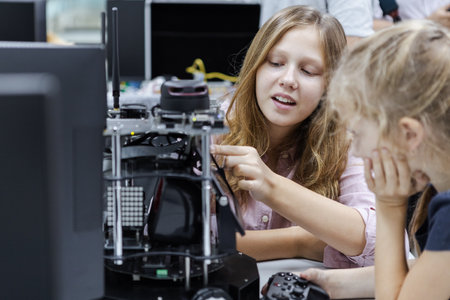 Girl Caucasian education electronic robotic on table at class room. learning innovation robot...