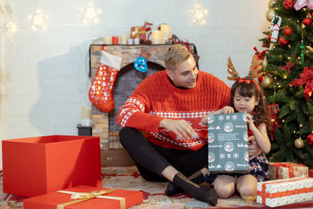 Happy father and little girl daughter celebration surprise christmas gifts box. Christmas and...