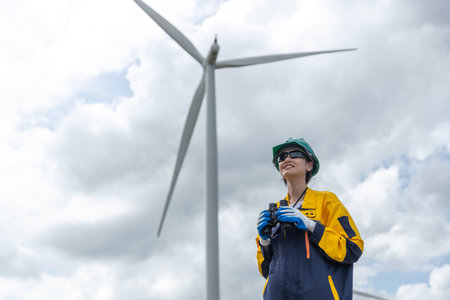 Renewable energy systems concept, engineer female working survey wind turbine for alternative energy, Technology protect environment reduce global warming problems.の写真素材