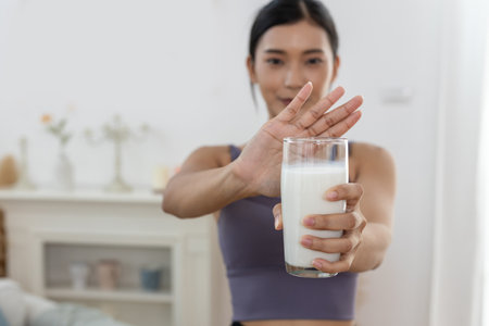 Female resistance deny drinking milk, symptom lactose allergy, concept of health problem, stop milk type drink, women intolerance ingredient from calcium, stomach ache painful.の写真素材