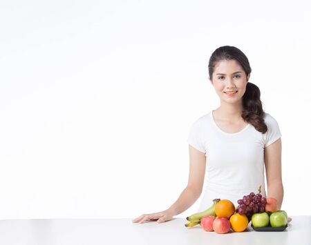 beautiful woman with healthy food, white background isolateの写真素材