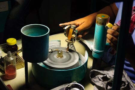 This is diamond cutting procss.It's changing a diamond from a rough stone into a faceted gem.