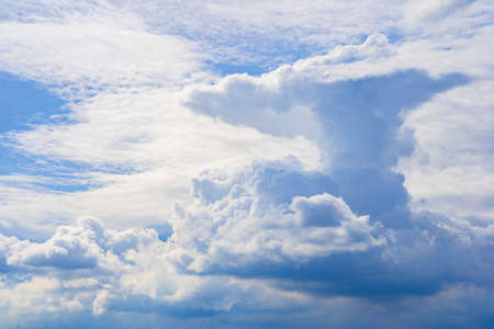 The sky is bright blue with beautiful fluffy clouds. blue sky with clouds