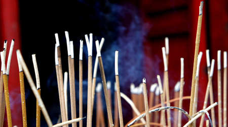 Burning incense sticks at shrineの写真素材