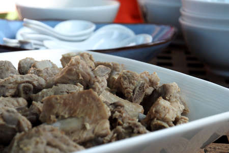 Boiled pork ribs ready to eat on white plateの写真素材
