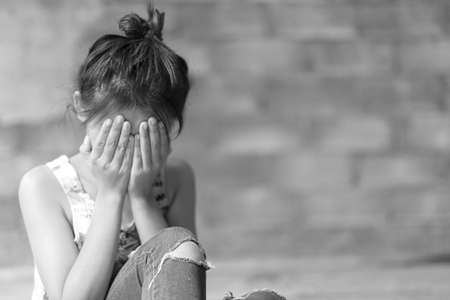 Woman in angle of abandoned building image blur , stop violence against Women, international women's dayの写真素材