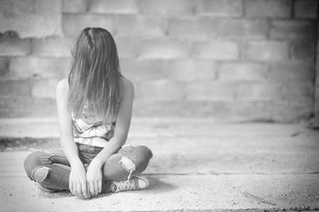 Woman  in angle of abandoned building image blur , stop violence against Women, international women's dayの写真素材