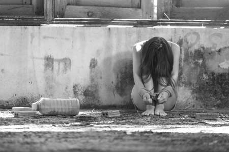 Woman bondage in angle of abandoned building image blur , stop violence against Women, international women's dayの写真素材