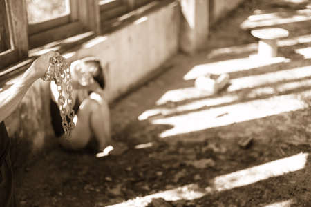 Woman bondage in angle of abandoned building image blur , stop violence against Women, international women's dayの写真素材