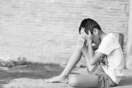 a Boy crying,fear in angle of abandoned building image blur Children violence. boy, lad with her hand extended signaling to Stop,child bondage in angle of abandoned building image blur and pain, afraid, restricted, trapped, call for help, struggle, terrifの写真素材