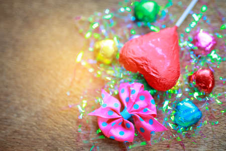 Valentines day red heart chocolate on wood background