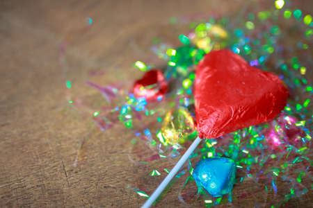 Valentines day red heart chocolate on wood backgroundの写真素材