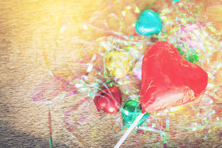 Valentines day red heart chocolate on wood background