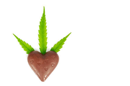 Chocolate  with marijuana leaf isolated on white background.の写真素材