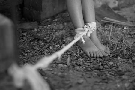Woman bondage in angle of abandoned building , stop violence against Women, international women's dayの写真素材