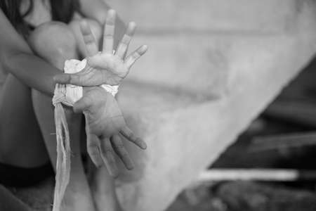 Woman bondage in angle of abandoned building , stop violence against Women, international women's dayの写真素材