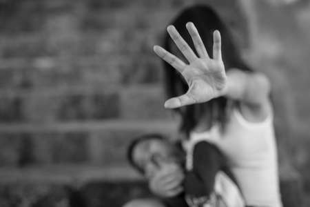 Woman bondage in angle of abandoned building , stop violence against Women, international women's dayの写真素材