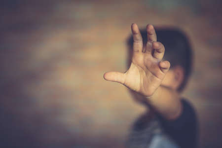 Stop abusing boy violence. child bondage in angle image blur , Human Rights Day concept.の写真素材