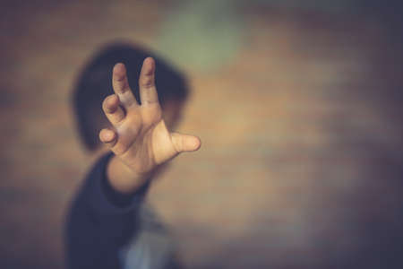 Stop abusing boy violence. child bondage in angle image blur , Human Rights Day concept.の写真素材