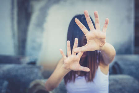 Woman bondage in angle of abandoned building image blur , stop violence against Women, international...