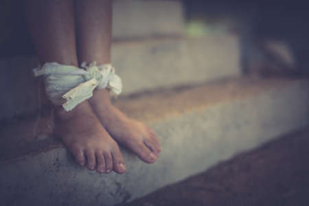 Woman bondage in angle of abandoned building image blur , stop violence against Women, international women's dayの写真素材