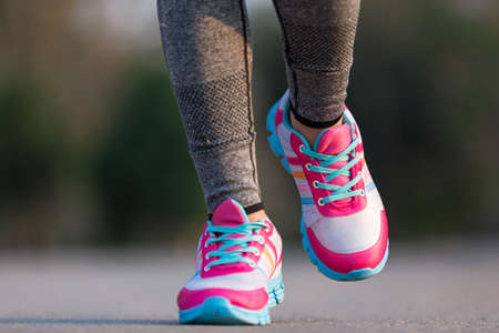 young fitness woman legs running