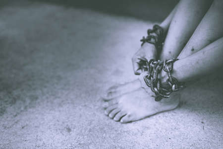Detailed black and white image blur incredible feet chained.の写真素材
