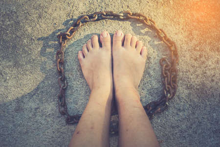 vintage tone of Shot focus of  Foot of Woman  Liberation from the chainsの写真素材