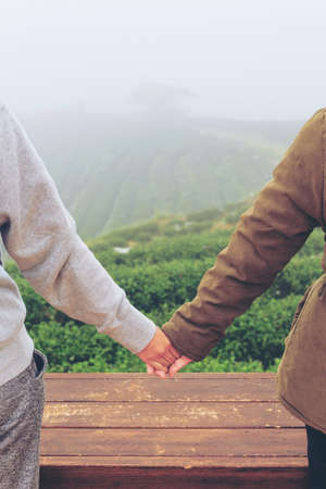 Young womens handshake, teenagers handshake in green nature background. Two hands together concept vintage.の写真素材