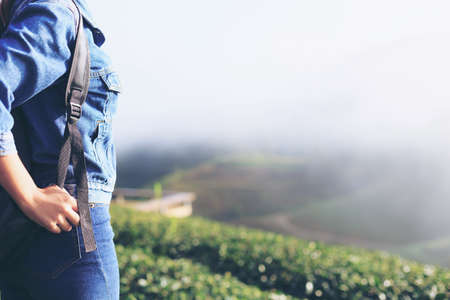 Woman looking fog on the mountain, Vintage toneの写真素材